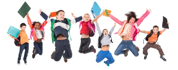 Grupo Niños Edad Escolar Saltando Aislados Blanco —  Fotos de Stock