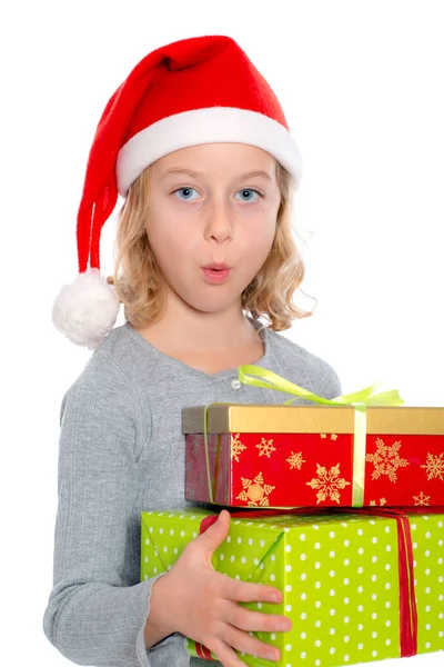 Verbaasd Meisje Met Santa Cap Aanwezig — Stockfoto