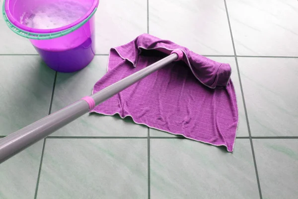 stock image house cleaning with scrubber and water bucket.