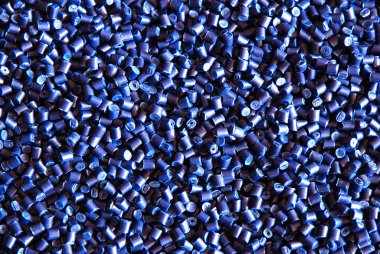 two different blue polymer resin pellets for injection molding isolated on white background clipart