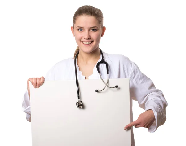 Жінка Лікар Тримає Знак Вказуючи Знак Посміхаючись Камеру — стокове фото