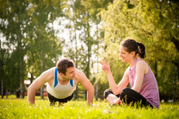 Man Making Push Ups While Woman Counting Number Outdoor Nature Stock Image
