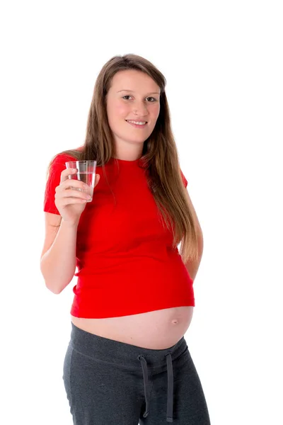 Giovane Donna Incinta Fronte Sfondo Bianco Sta Bevendo Acqua — Foto Stock