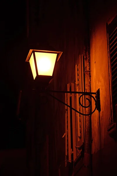 lantern,lamp,street light,street lamp,rovinj,istria croatia,old town,alley,house,building,architecture,night,evening,night,light,lights,lighting