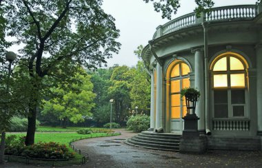 Palace in park at evening in Saint Petersburg, Russia. clipart