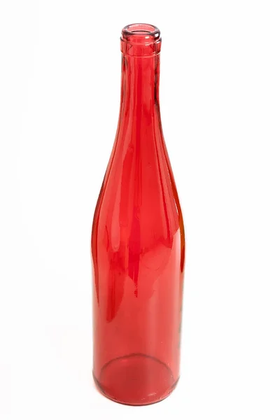 Κόκκινο Γυάλινο Άδειο Μπουκάλι Ένα Ελαφρύ Φόντο — Φωτογραφία Αρχείου