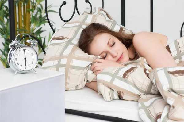 woman in bed in the morning is still asleep sleep tight