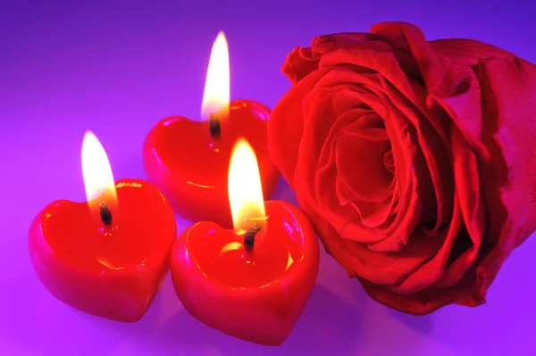 Three Glowing Red Heart Shaped Candles Red Rose — Φωτογραφία Αρχείου