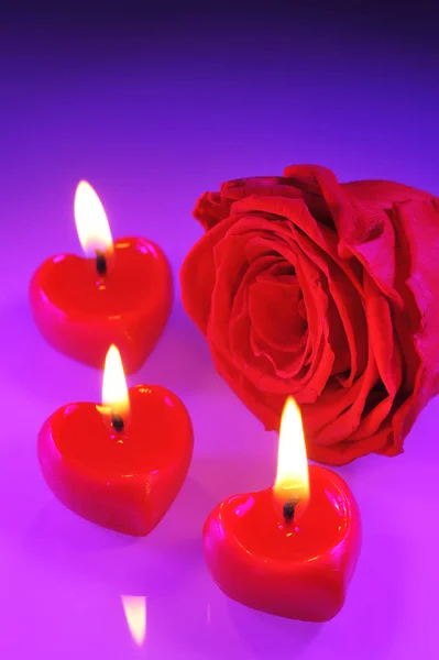 Three Glowing Red Heart Shaped Candles Red Rose — Stock Photo, Image