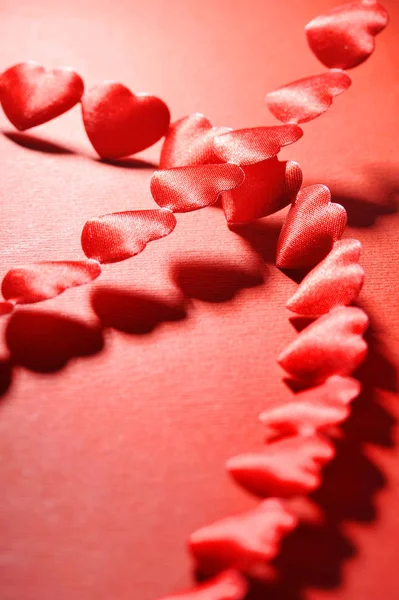 Chain Small Red Fabric Heart Red Background — Fotografia de Stock