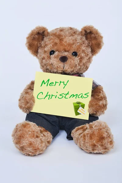 Medvídek Drží Ceduli Která Říká Veselé Vánoce Izolované Bílém Pozadí — Stock fotografie