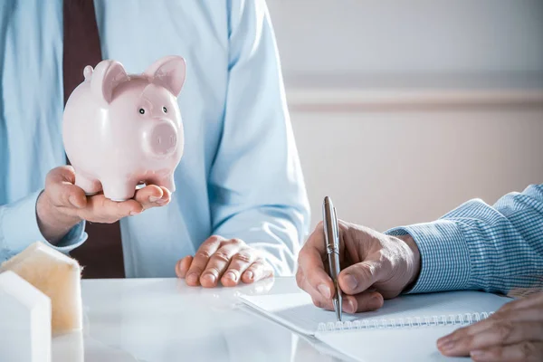 Close Business Man Holding Pink Piggy Bank Meeting Worker Taking — Stock fotografie