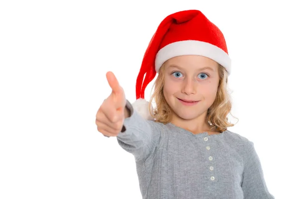 Noel Baba Şapkası Başparmağı Havada Güzel Sarışın Bir Kız — Stok fotoğraf