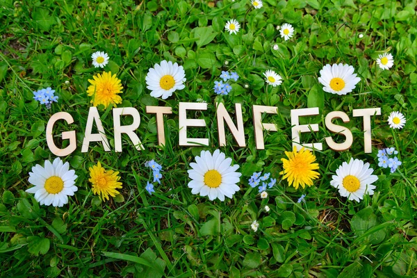 garden party garden party text letters on colorful flower meadow