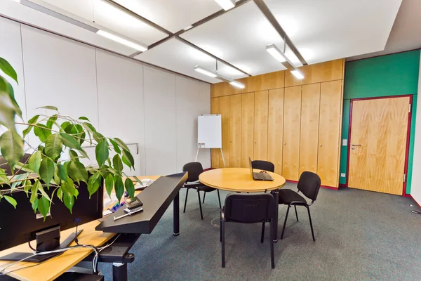 interior of a modern school with a table