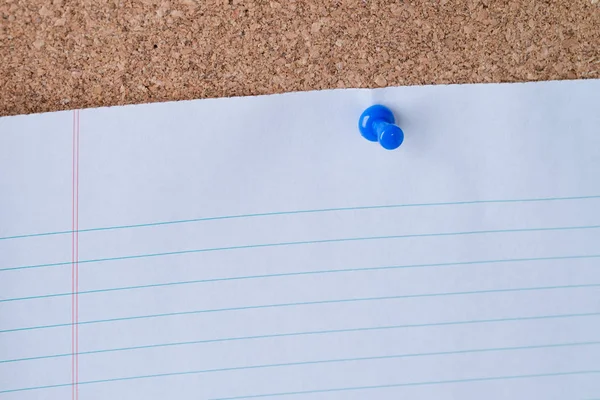 Blue Thumb Tack Holding White Piece Lined Loose Leaf Paper — Stock Photo, Image