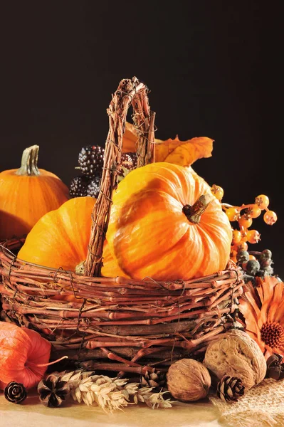 Erntedankfest Various Pumpkins Rattankorb Front Brown Background Candlelight — Stock fotografie