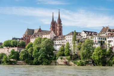 View up to the cityscape of Basel with its famous red sandstone cathedral. clipart