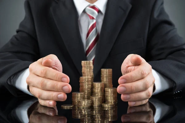 Close Businessman Saving Pile Coins Desk — Stock Photo, Image