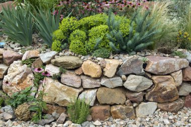 stone wall with plants and flowers clipart