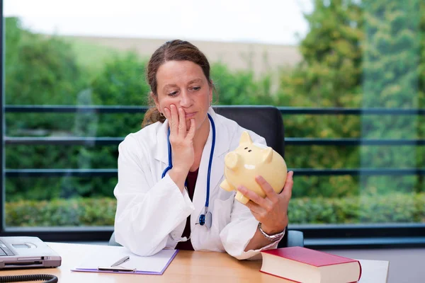 Young Female Doctor Her Office Piggy Bank — Stock Photo, Image