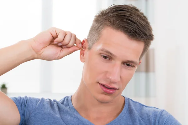 Close Young Man Cleaning His Ear — Stock Photo, Image
