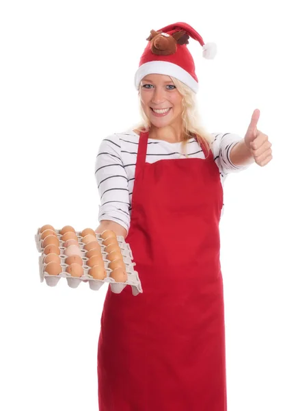 Mujer Con Sombrero Santa Delantal Sosteniendo Una Paleta Huevos — Foto de Stock