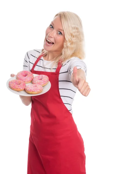 Önlüklü Kadın Donut Tutuyor Baş Parmağını Kaldırıyor — Stok fotoğraf