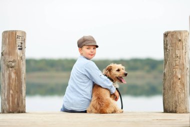 little boy with his dog clipart