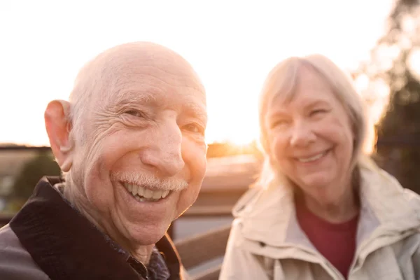 Cute Caucasian Couple Sitting Together Outdoors — Stock Photo, Image