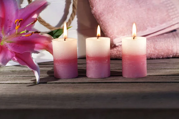 Candles Flower Towels Wooden Table — Stock Photo, Image