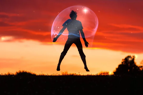 Silhouette Happy Boy Bubble Jumping Air Field Red Orange Sky — Foto de Stock