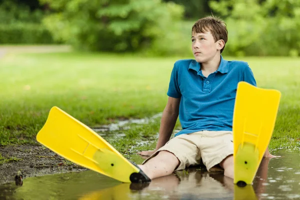 Daydreaming Male Teenager Wearing Shorts Diving Fins Sitting Back Large — 스톡 사진