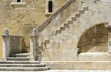 Wonderful stone staircase in the courtyard of the Swabian castle of Gioia del Colle - Apulia, Italy clipart