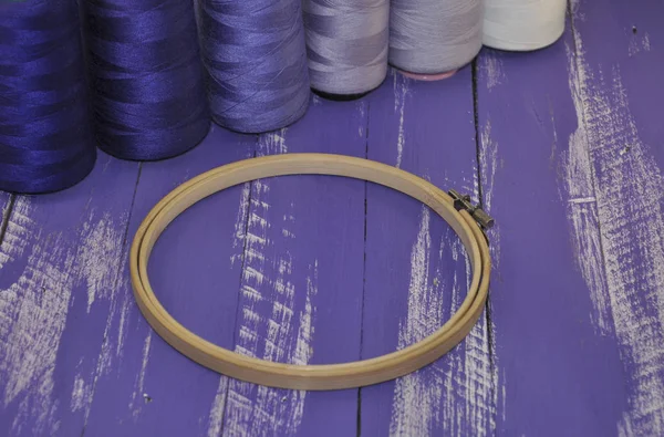 Wooden hoop for embroidery on a background thread