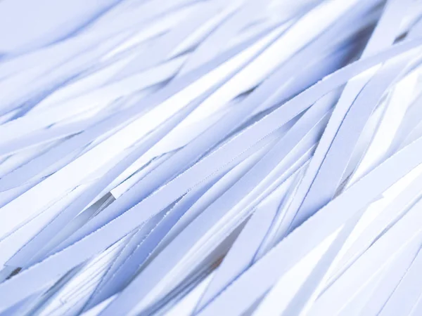 Paper documents cut into strips with a paper shredder