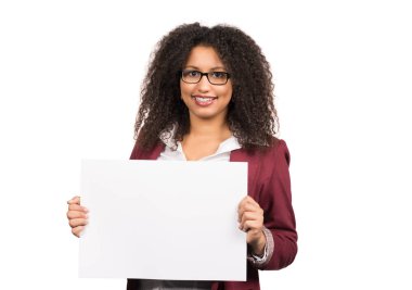 full-time photo of a young woman with curly dark hair (afro) and glasses holding a white blank sheet of paper. clipart