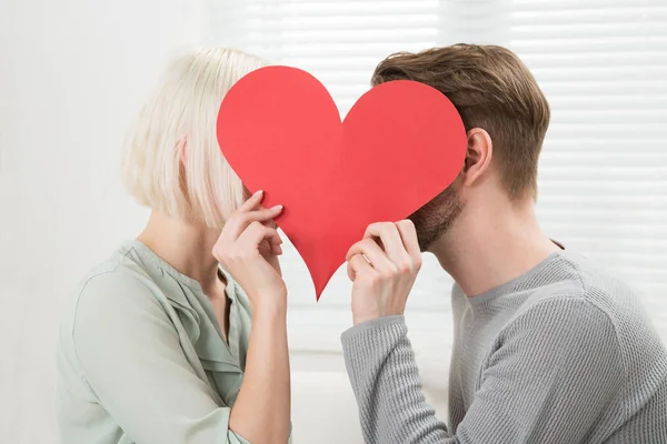 Close Young Kissing Hiding Heart Shape — Stock Photo, Image