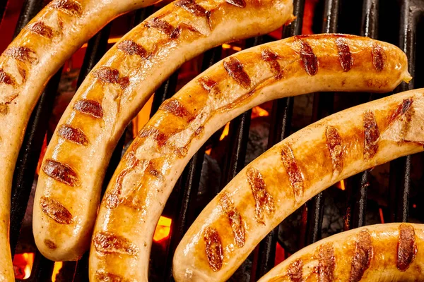 Five Single Beef Sausages Cooking Top Grill Flames Hot Coals — Stock Photo, Image