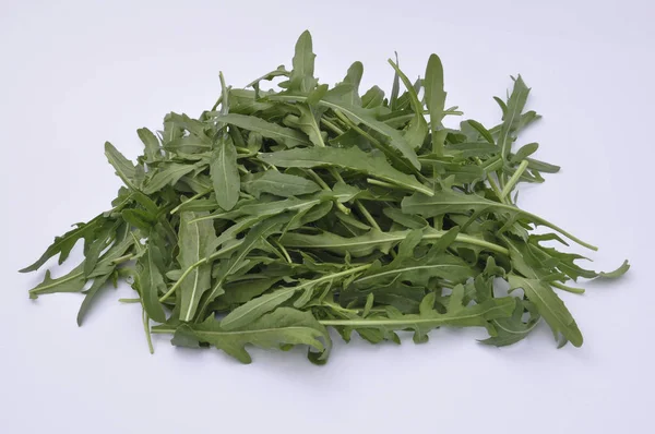 Många Gröna Ruccola Vit Bakgrund — Stockfoto