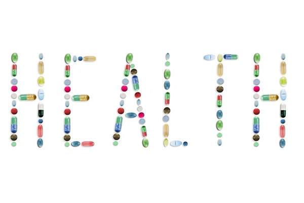 Pigułki Tabletki Kolorowe Litery Tekst Słowo — Zdjęcie stockowe