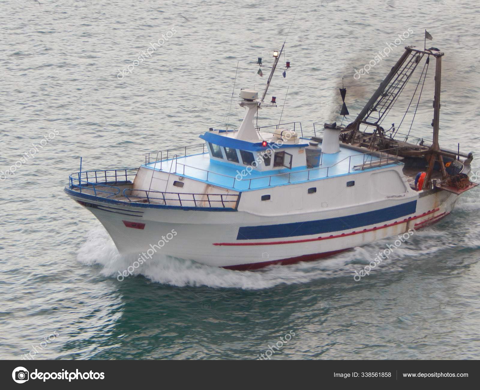 Small Fishing Boat Trawls Full Speed Sea — Stock Photo © PantherMediaSeller  #338561858