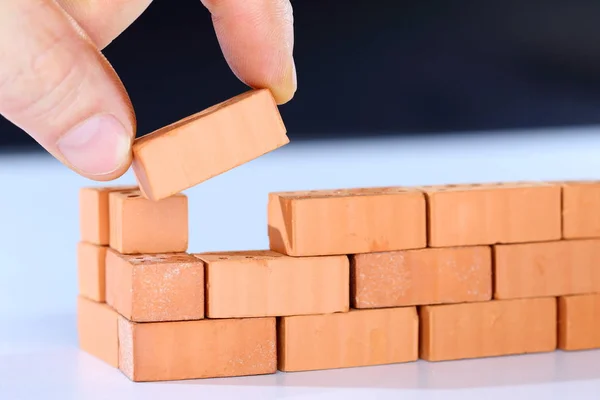 Wooden Blocks Hand Brick Wall Background — Stock Photo, Image