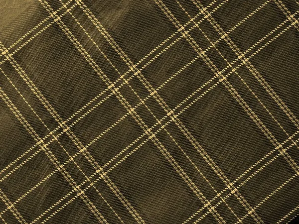 背景のヴィンテージセピアとして役立つ伝統的なスコットランドのタータン繊維パターン — ストック写真