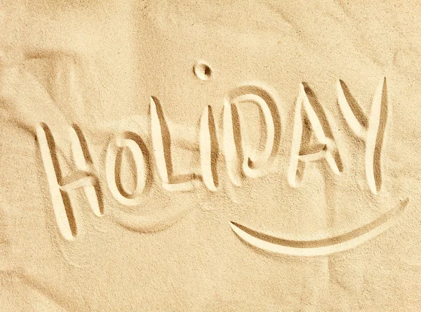 Palavra Holiday Escrito Mão Areia Praia Dourada Uma Imagem Conceitual — Fotografia de Stock