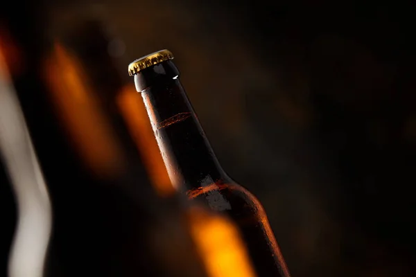 Tilted Angle View Unopened Unlabelled Glowing Beer Bottle Selective Focus — Stock Photo, Image