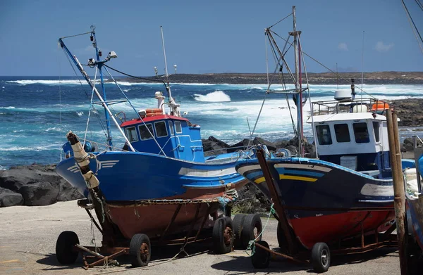 2 fishing boats in the fishing village of la sante on the west coast of lanzarote