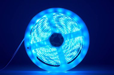 three meter long strip light with bright shining leds. clipart