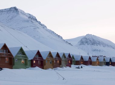 Colourful houses line the streets of Longyearbyen, the largest settlement in the Svalbard archipelago in the Arctic Circle, in Spitsbergen, Norway clipart