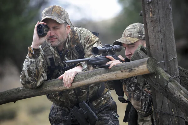 Two hunters stalking deer, John Day, Oregon, USA
